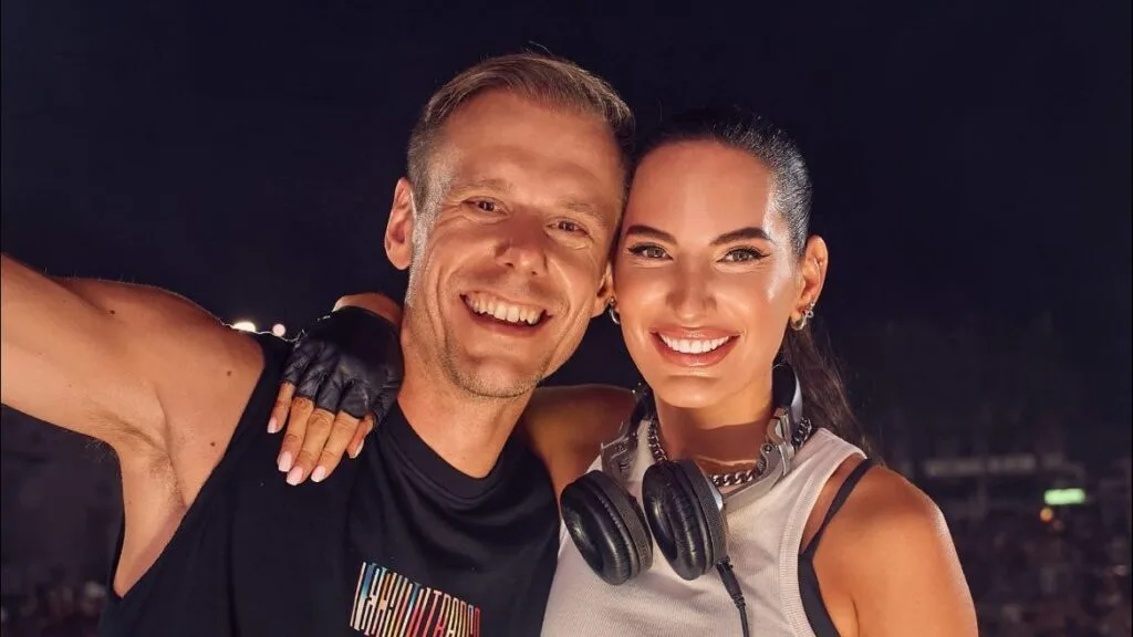 Lilly Palmer and Armin van Buuren smiling together backstage.
